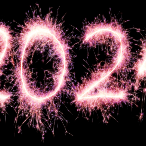 Année 2024 lumineux, style feu d'artifice, sur un fond noir
